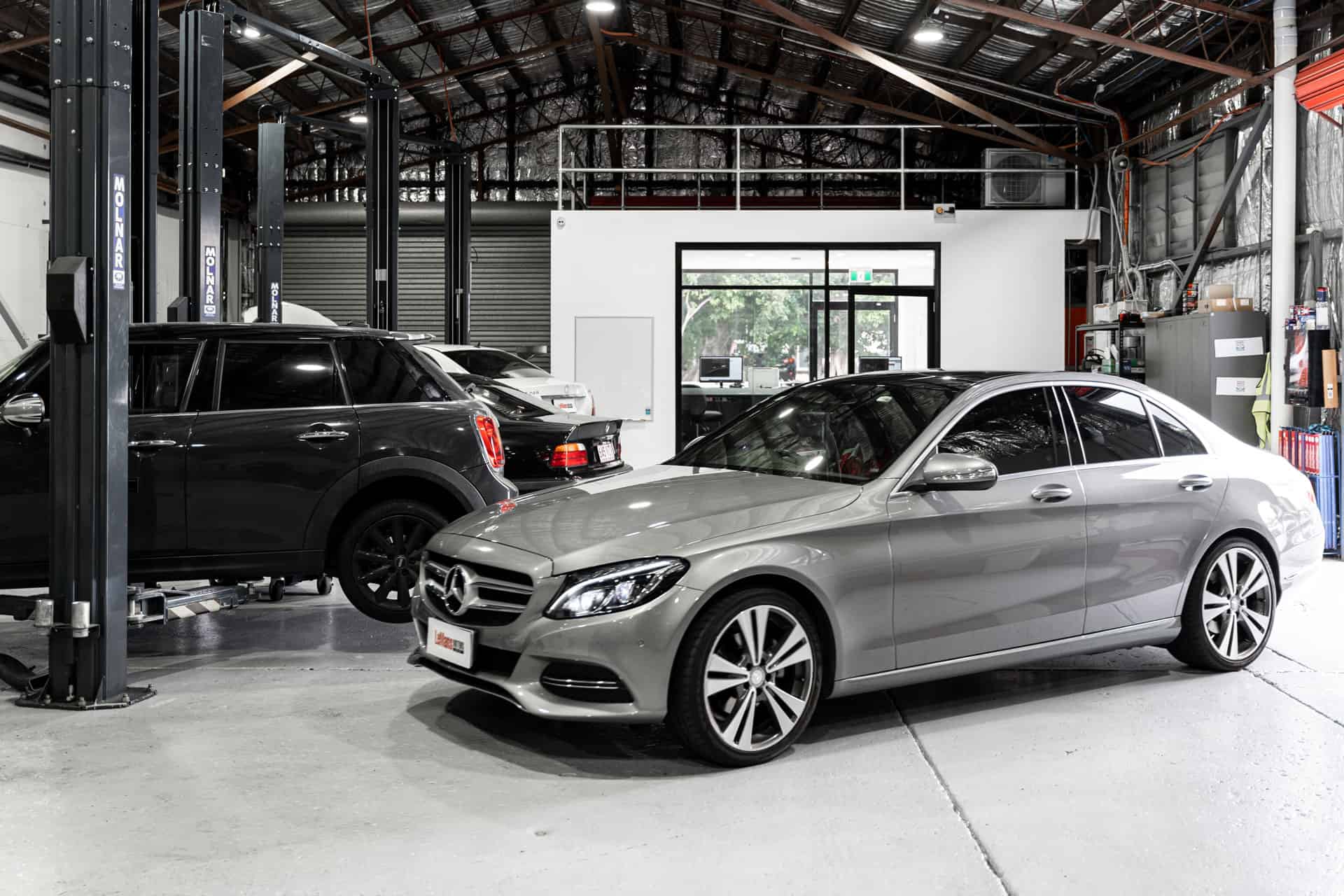 A Mercedes and other cars in the European Car Servicing Bulimba workshop
